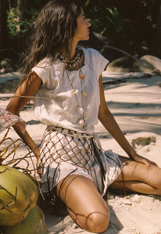  a white skirt with a brown net pattern