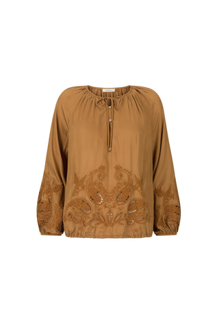 A tan long-sleeve blouse with a drawstring neckline and intricate embroidered paisley patterns on the front and sleeves, shown against a plain white background.