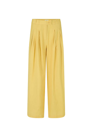 A pair of wide-leg cropped trousers in a soft mustard yellow, featuring pleated detailing down the front of the legs and a button closure at the waistband, shown against a plain white background.