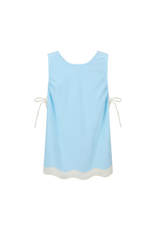 A light blue sleeveless top with cream-colored drawstring ties on the sides and a scalloped cream hem, shown flat against a white background.