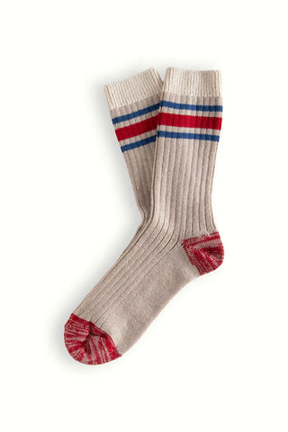 Beige sock with red and blue stripes on a white background