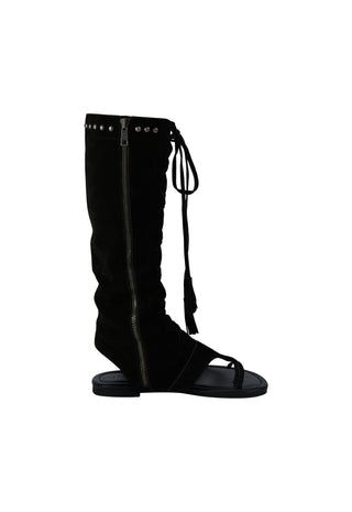 A black suede knee-high boot with a side zipper, silver studs, and a lace-up front detail, shown against a plain white background.